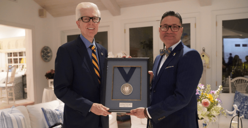 UC Merced Chancellor Juan Sanchez Munoz and Governor Gray Davis pose with the Chancellor's Medal